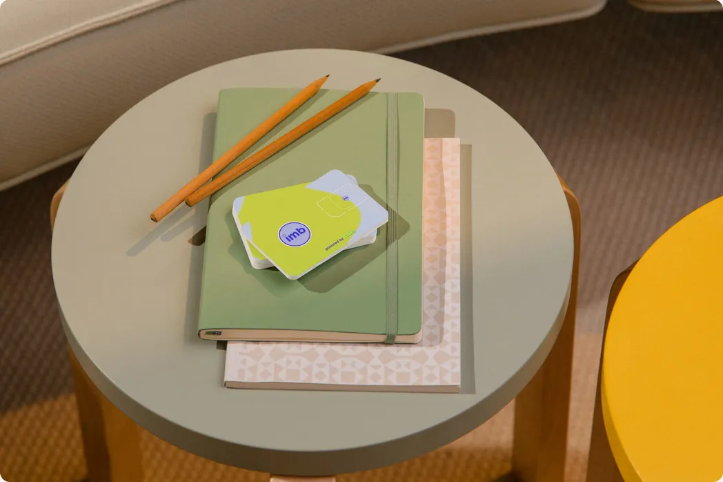 IMB business card on a side table